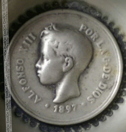 Photo 2 Pièce de monnaie non identifiée: moneda incrustada